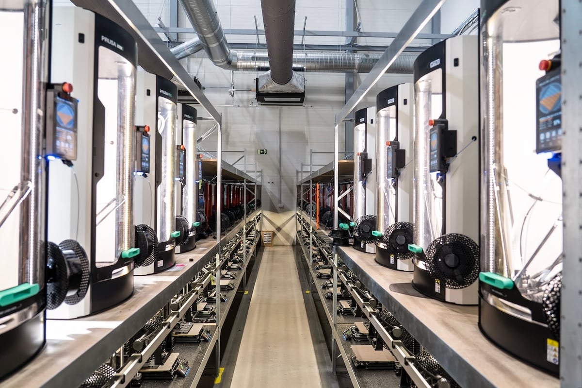 Prusa printers in racks running as a print farm
