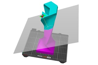 Cut tool splitting a large model with alignment pins shown at the cut interface