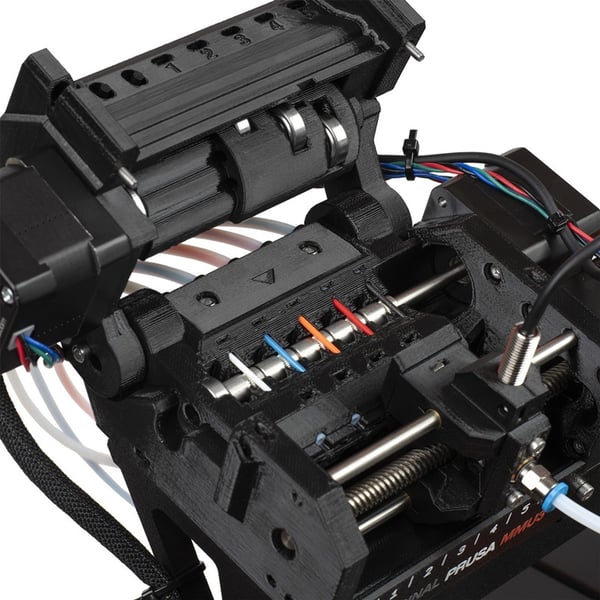MMU3 unit mounted on CORE One showing LCD status during a long multi-color print