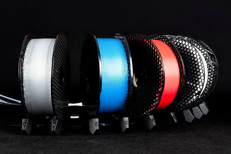 Five different brand filament spools loaded into the MMU3 spoolholder rack